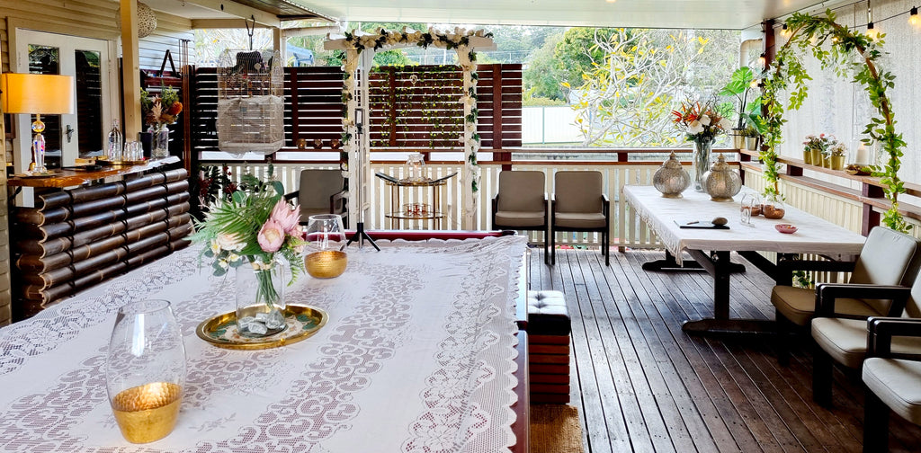 Indoor setting with a dining table, chairs, and decorative elements. Christina Towler celebrancy civil celebrant back patio wedding ceremony venue