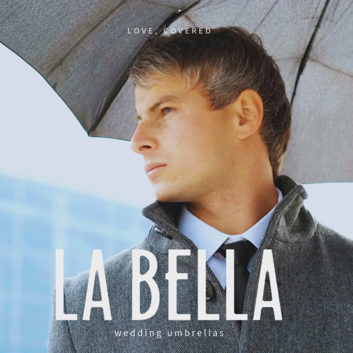close up groom under charcoal umbrella video square